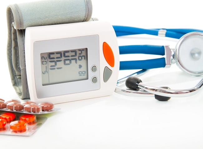 Stethoscope, blood pressure checker and pills, tablets isolated